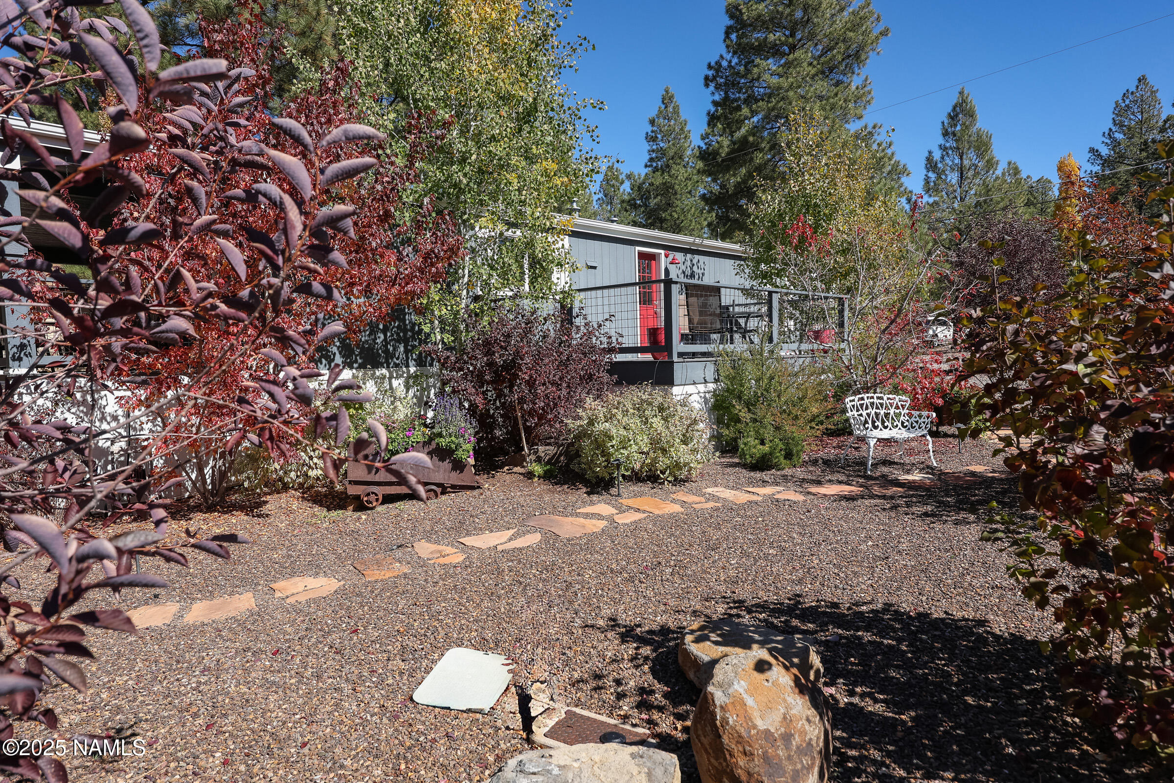 17265 Buffalo Run Munds Park, AZ 86017 - Photo 43 of 51 a view of a chairs and table in the yard