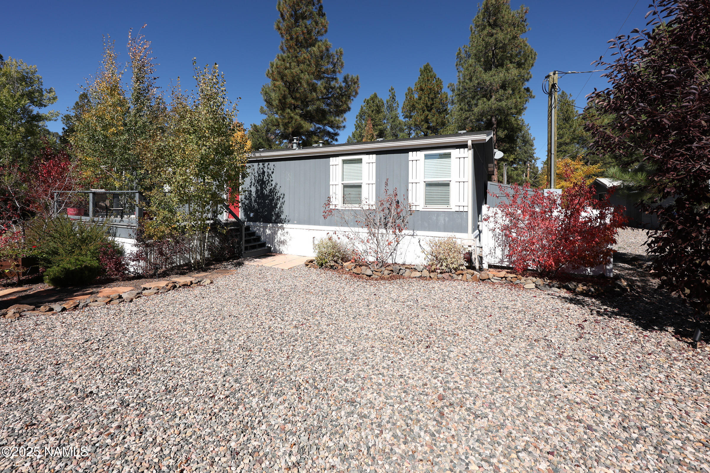 17265 Buffalo Run Munds Park, AZ 86017 - Photo 51 of 51 a view of a house with a yard and tree s