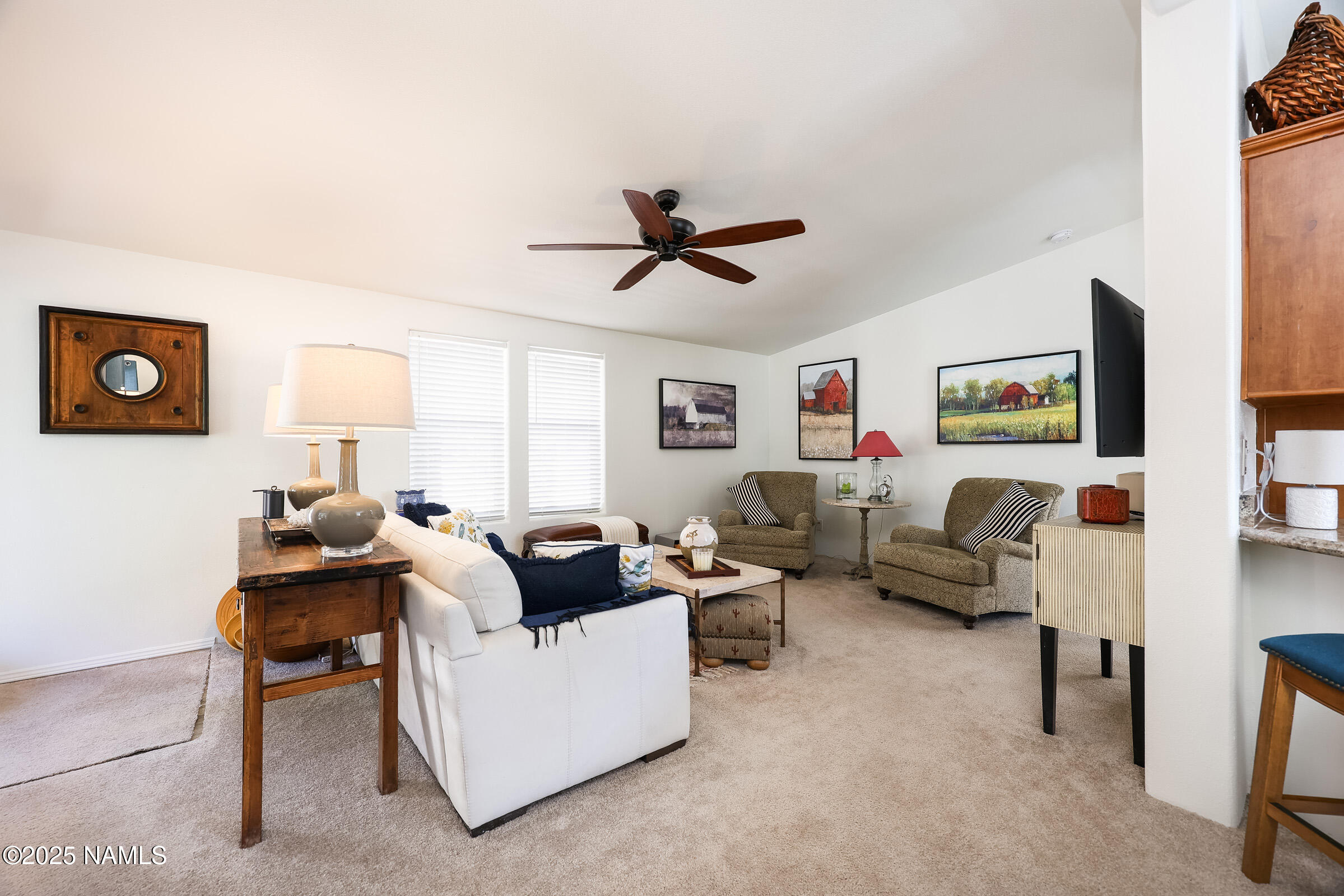 17265 Buffalo Run Munds Park, AZ 86017 - Photo 6 of 51 a living room with furniture and a ceiling fan