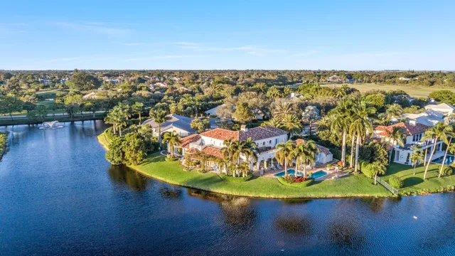 an aerial view of a house with a lake view