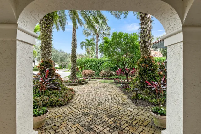 a living room with fireplace furniture and a wooden floor