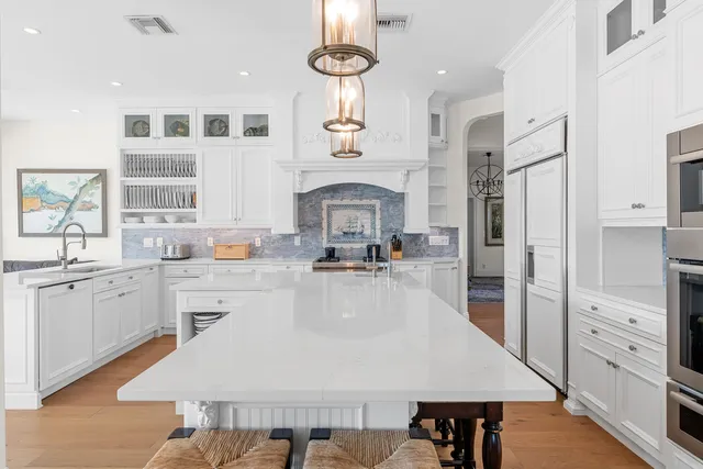 a bedroom with a bed outdoor view and a large window