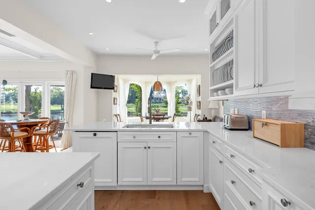 a bedroom with a bed and glass wall