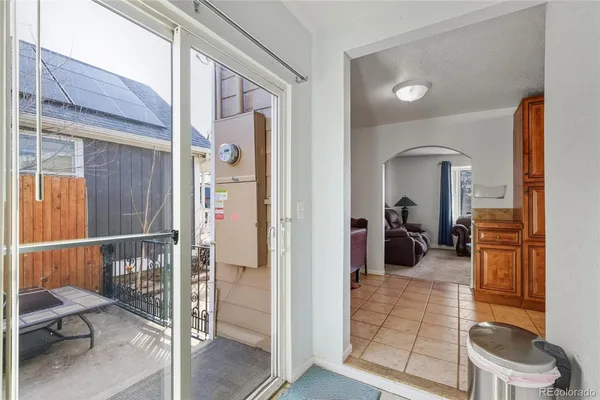 a view of a livingroom with furniture and front door