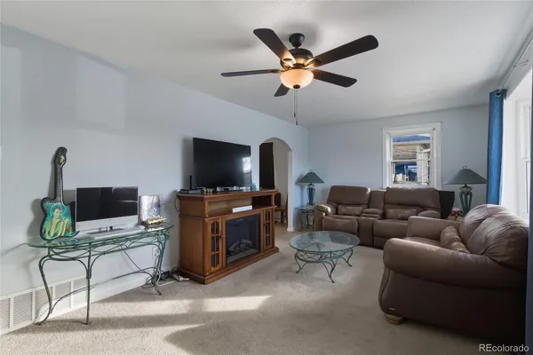 a living room with furniture and a flat screen tv