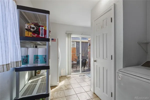 a view of a hallway with workspace and window