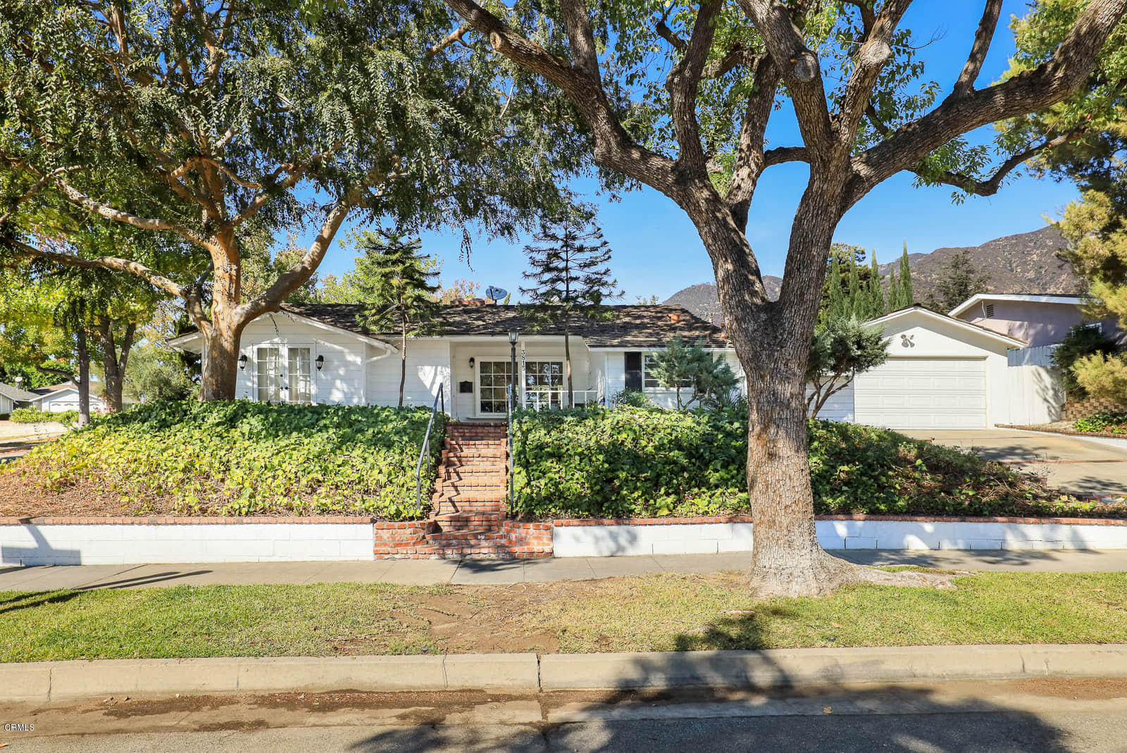 3815 Cartwright Street Pasadena, CA 91107 - Photo 1 of 25 a front view of a house with garden