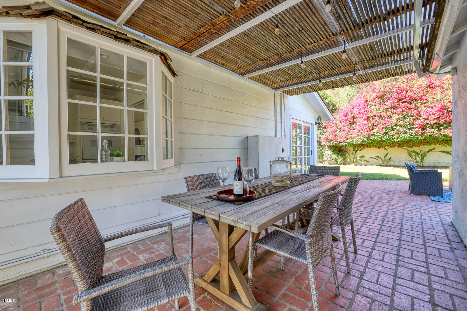 3815 Cartwright Street Pasadena, CA 91107 - Photo 21 of 25 a view of a backyard with table and chairs with wooden floor and fence