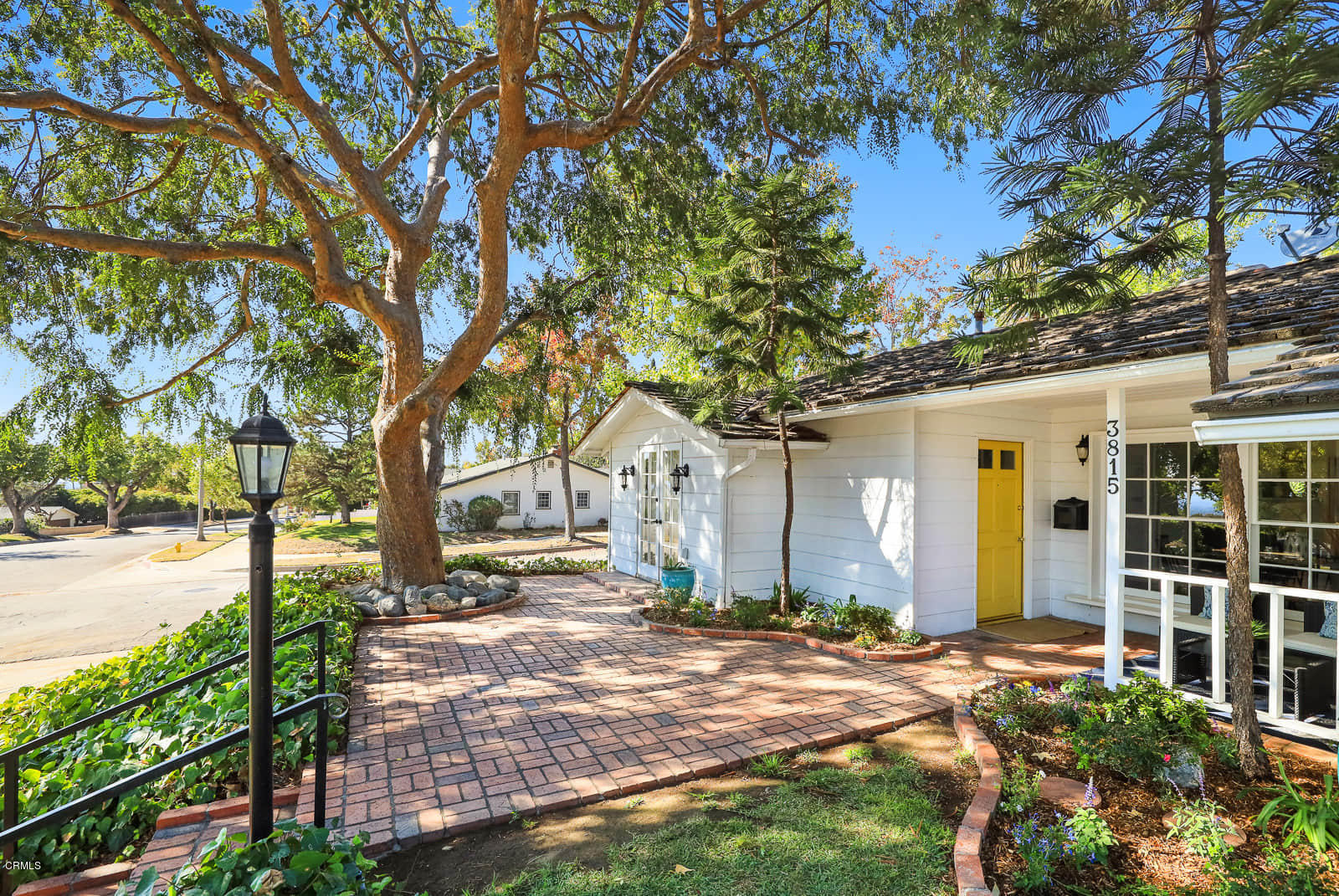 3815 Cartwright Street Pasadena, CA 91107 - Photo 4 of 25 a front view of a house with a yard and potted plants