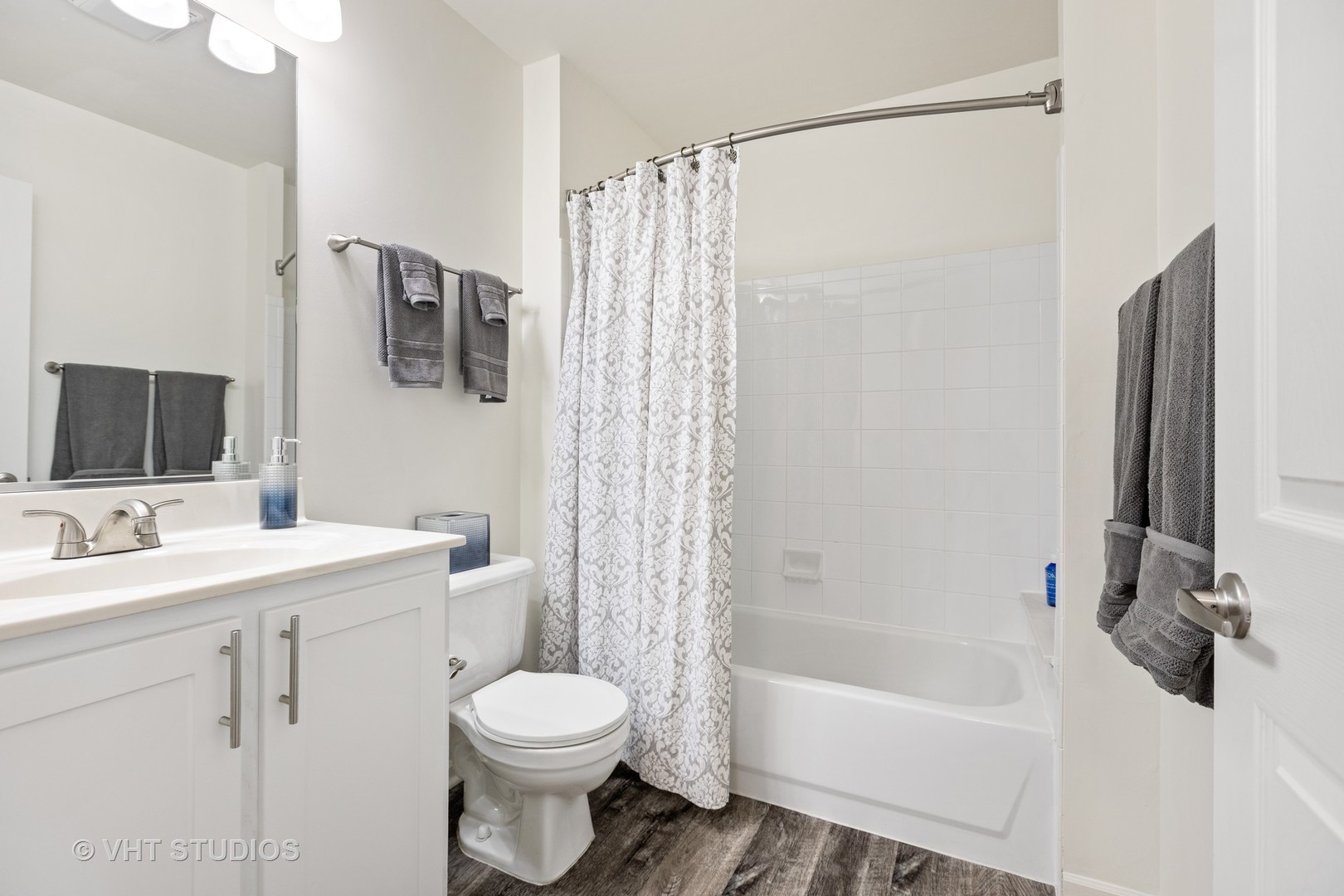 406 Mozart Court, Unit 406 Wheaton, IL 60189 - Photo 45 of 61 a bathroom with a sink a toilet and shower