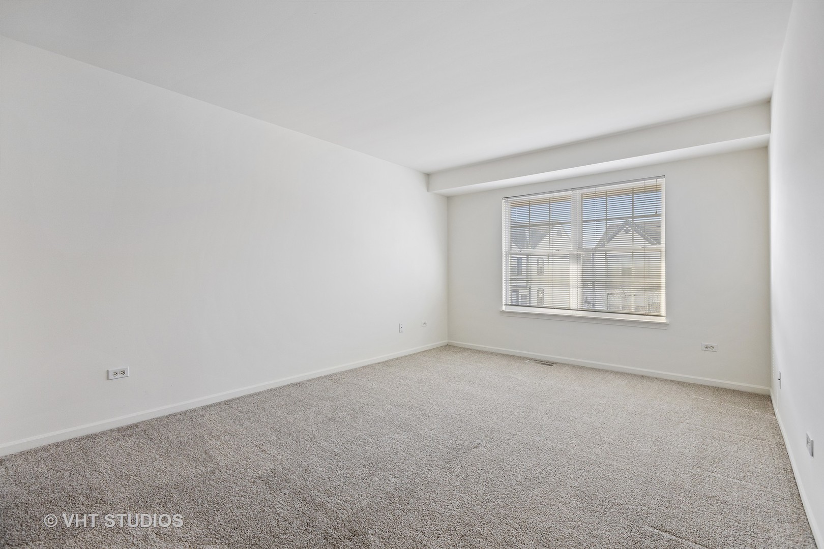 406 Mozart Court, Unit 406 Wheaton, IL 60189 - Photo 48 of 61 an empty room with windows