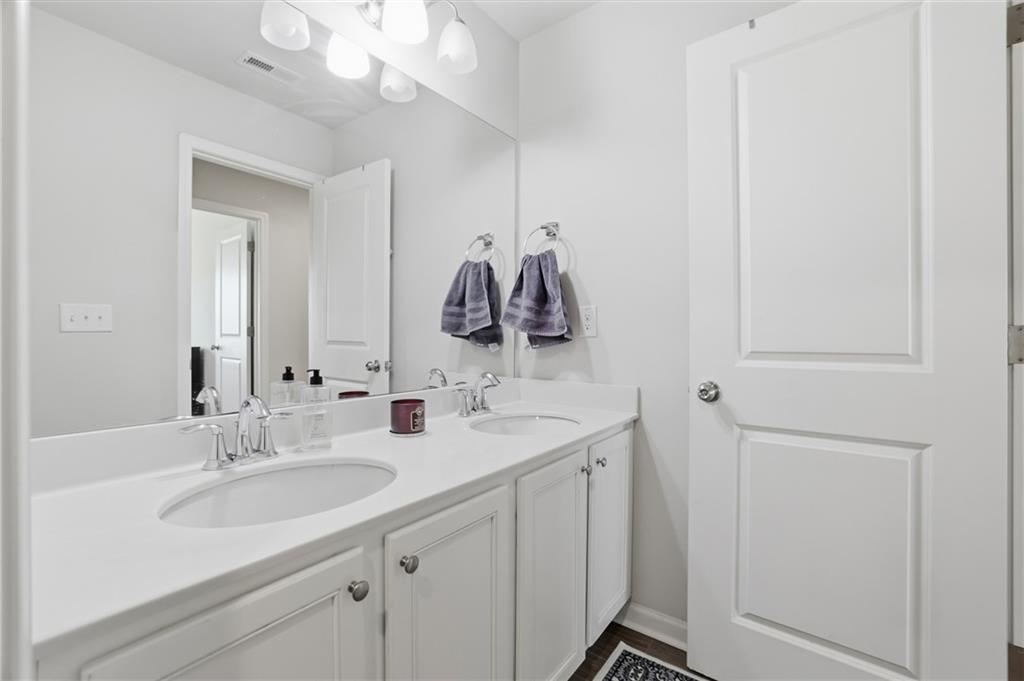 175 Paxton Lane Jefferson, GA 30549 - Photo 29 of 39 a bathroom with a sink and a mirror