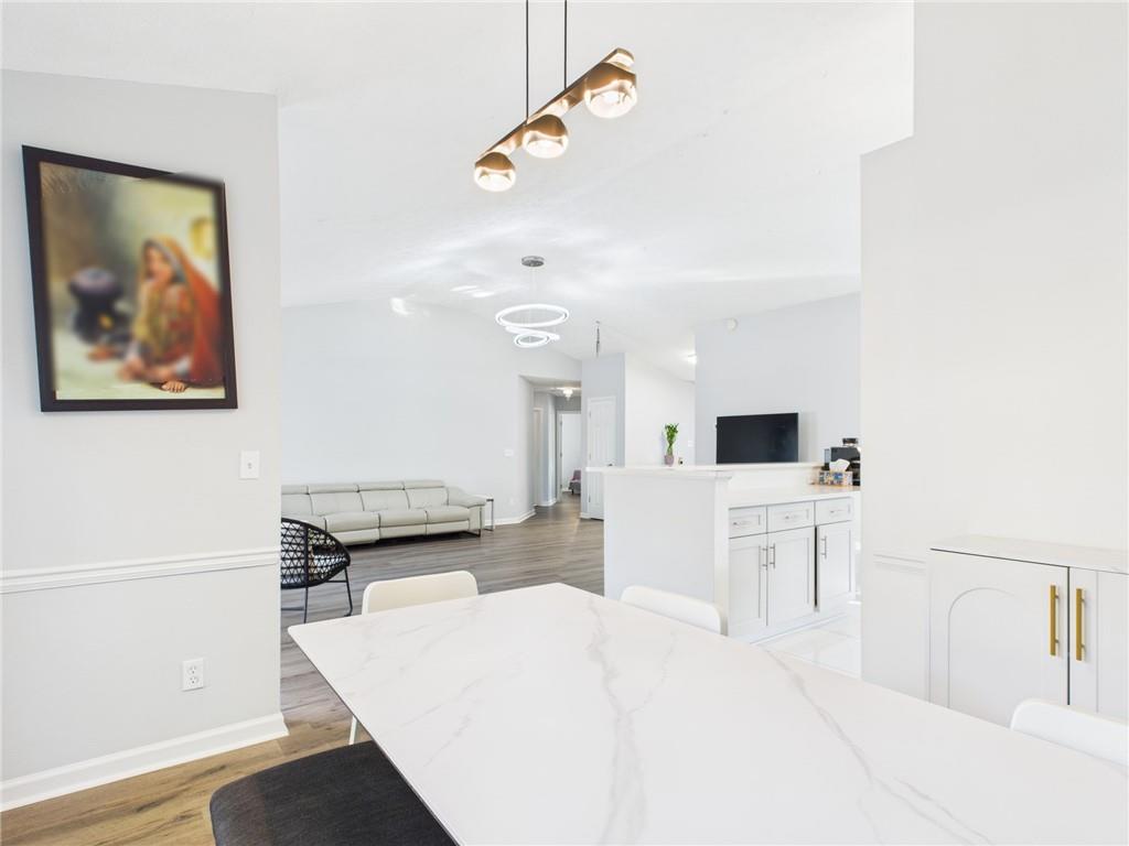 4060 Brooks Bridge Crossing Alpharetta, GA 30022 - Photo 11 of 30 a living room with furniture and a flat screen tv