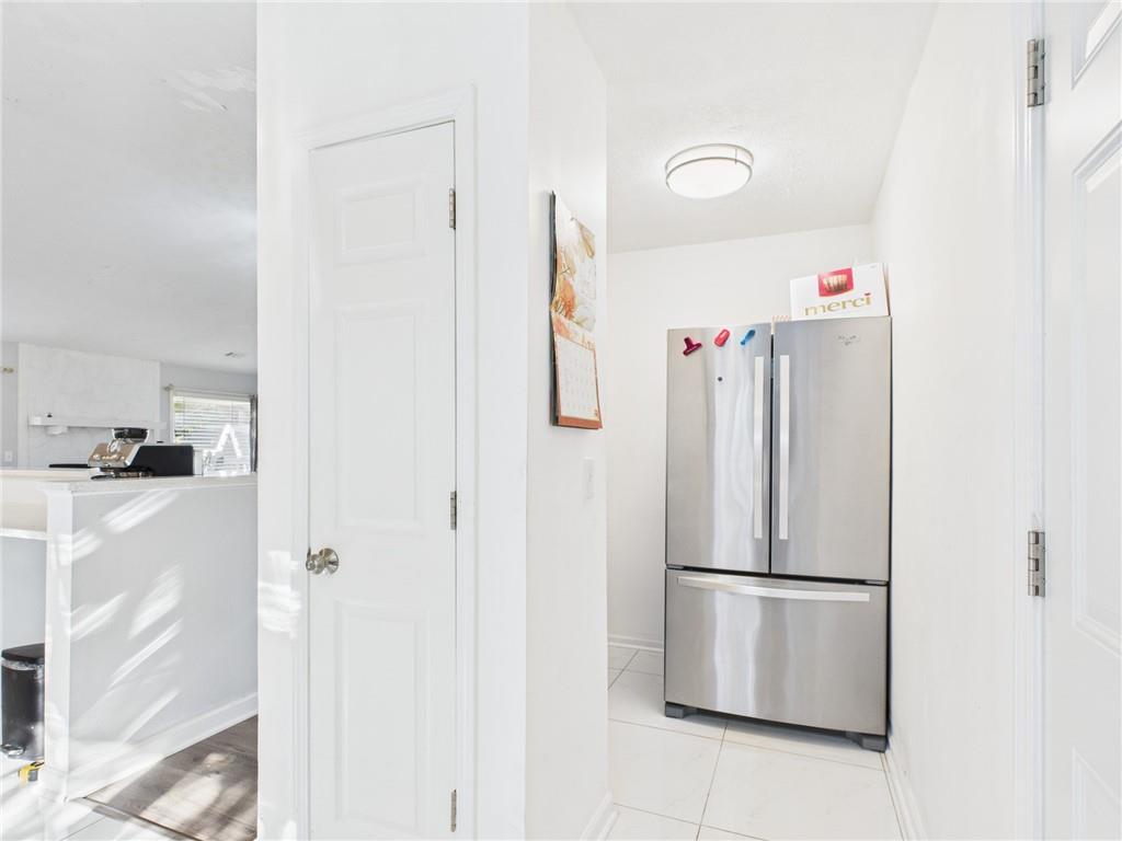 4060 Brooks Bridge Crossing Alpharetta, GA 30022 - Photo 14 of 30 a view of kitchen with white refrigerator