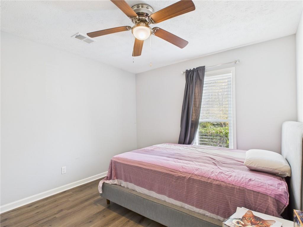 4060 Brooks Bridge Crossing Alpharetta, GA 30022 - Photo 16 of 30 a bedroom with a bed and a window