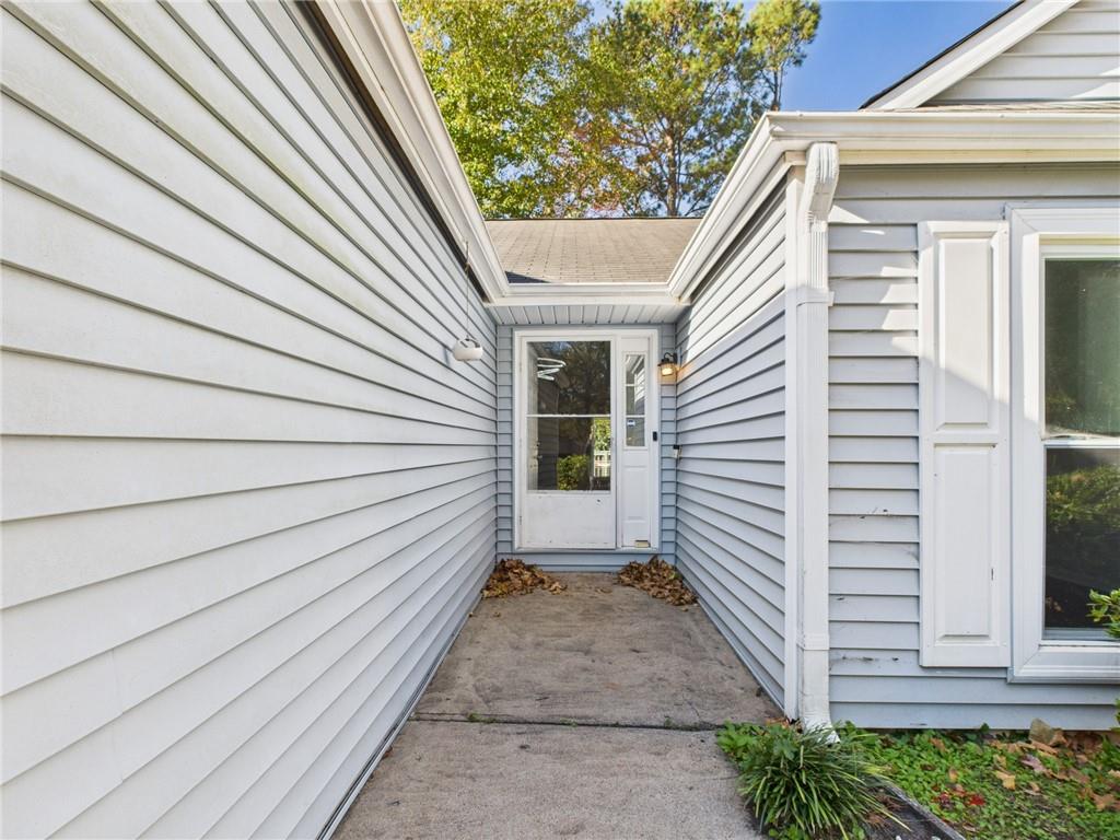 4060 Brooks Bridge Crossing Alpharetta, GA 30022 - Photo 27 of 30 a view of a house with a door and wooden floor
