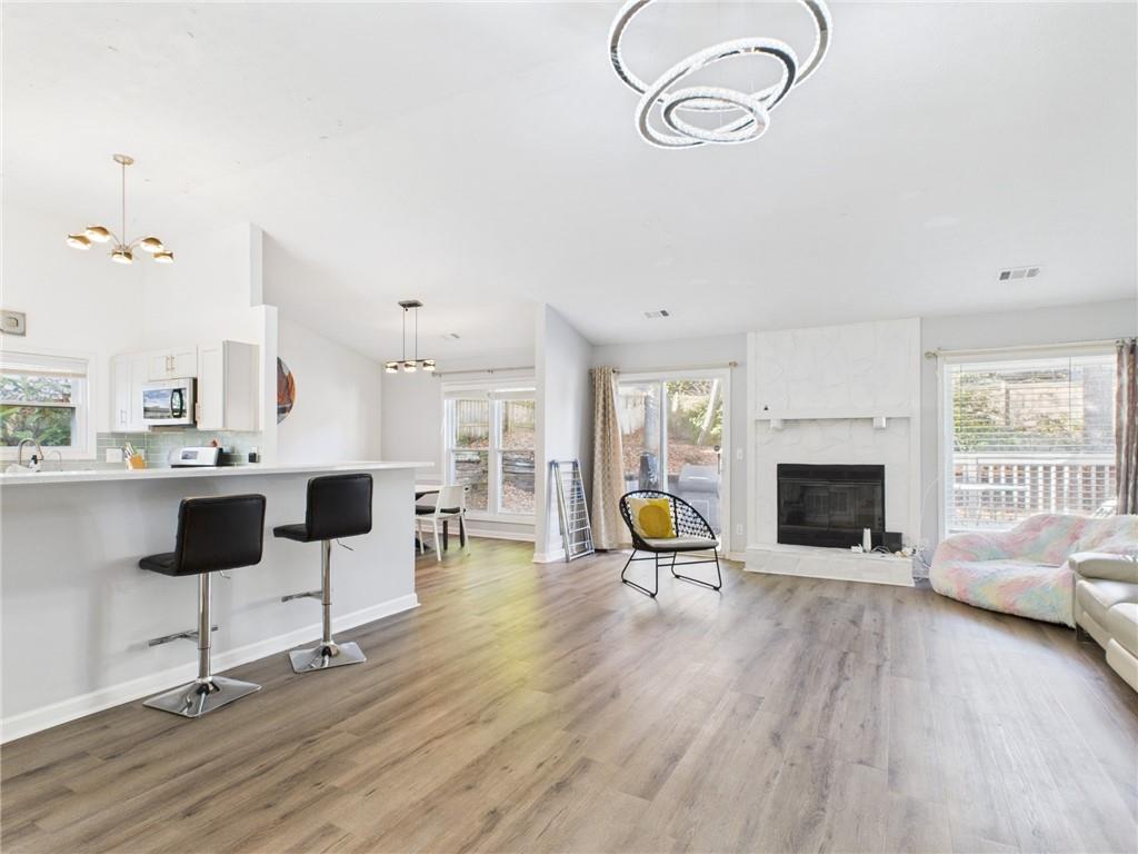 4060 Brooks Bridge Crossing Alpharetta, GA 30022 - Photo 4 of 30 a living room with furniture pool table and a fireplace