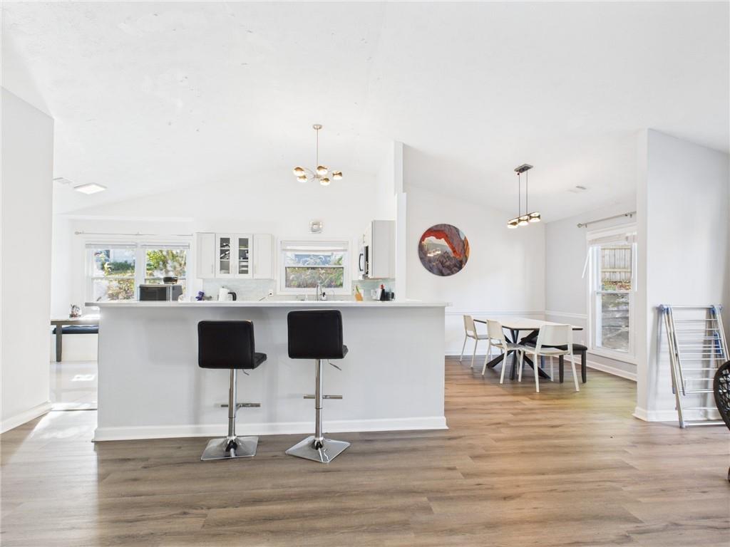 4060 Brooks Bridge Crossing Alpharetta, GA 30022 - Photo 5 of 30 a living room with lots of furniture and a wooden floor