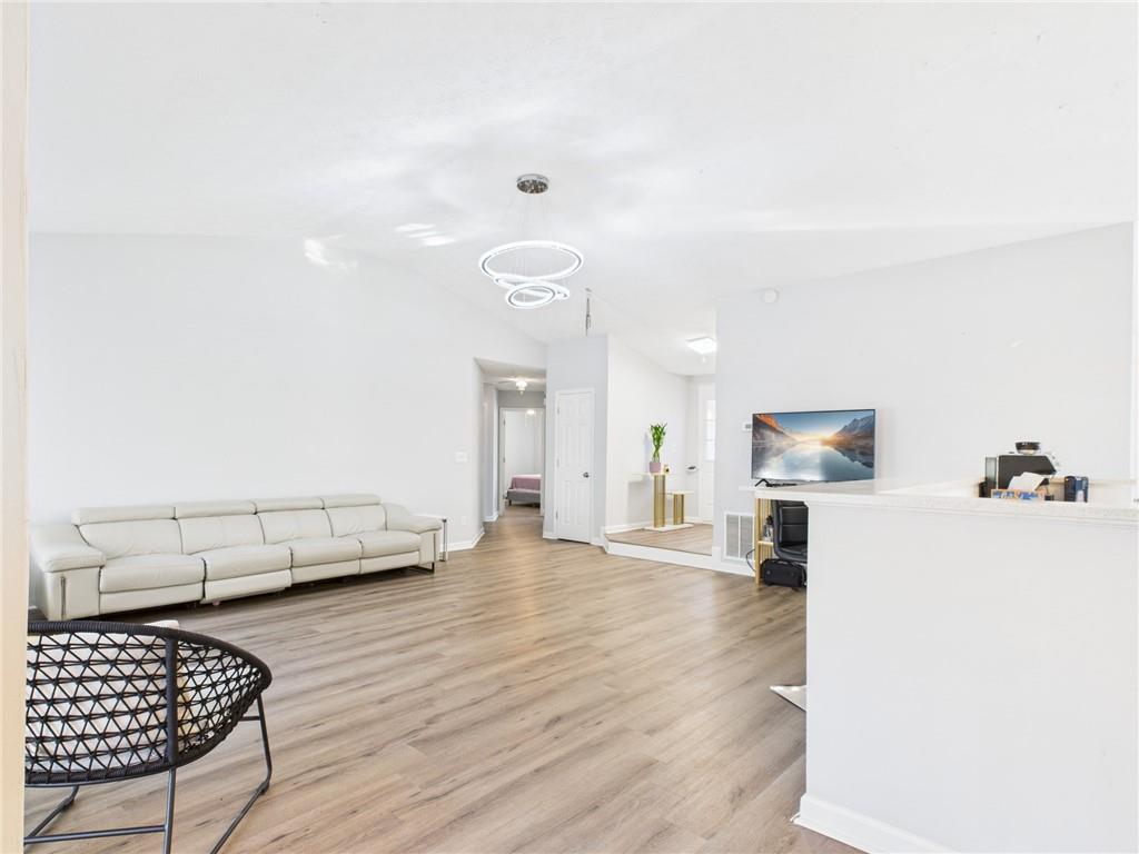 4060 Brooks Bridge Crossing Alpharetta, GA 30022 - Photo 10 of 30 a living room with furniture and a couch