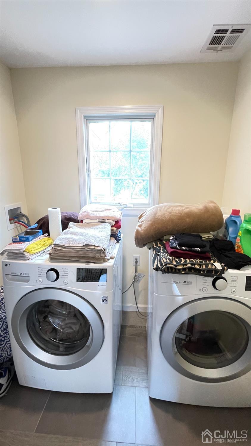 121 Idlewild Road Edison, NJ 08817 - Photo 22 of 28 a utility room with dryer and washer