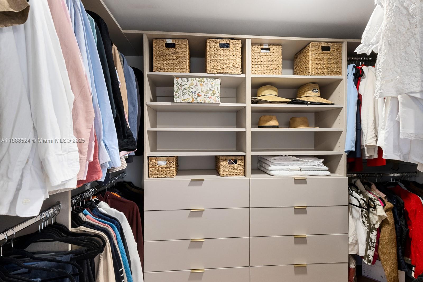 141 Crandon Boulevard, Unit 446 Key Biscayne, FL 33149 - Photo 14 of 30 a view of walk in closet with clothes and shoes