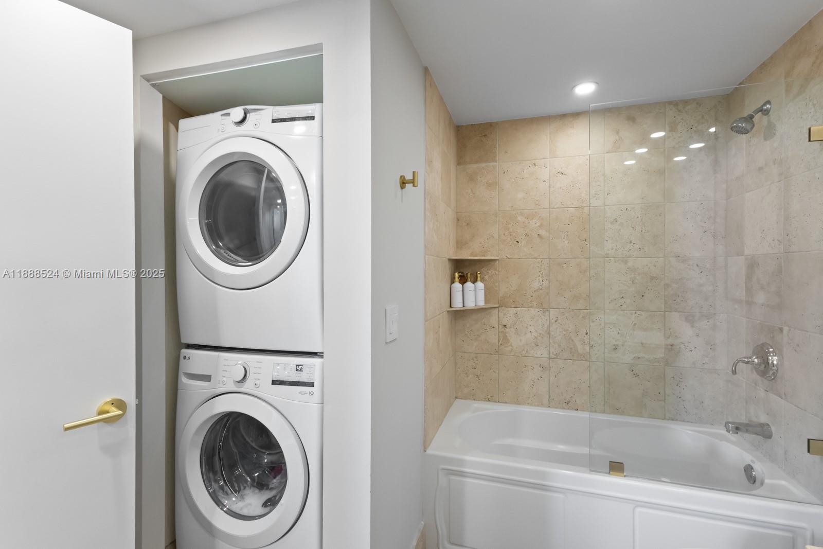 141 Crandon Boulevard, Unit 446 Key Biscayne, FL 33149 - Photo 20 of 30 a bathroom with a sink a toilet and a mirror