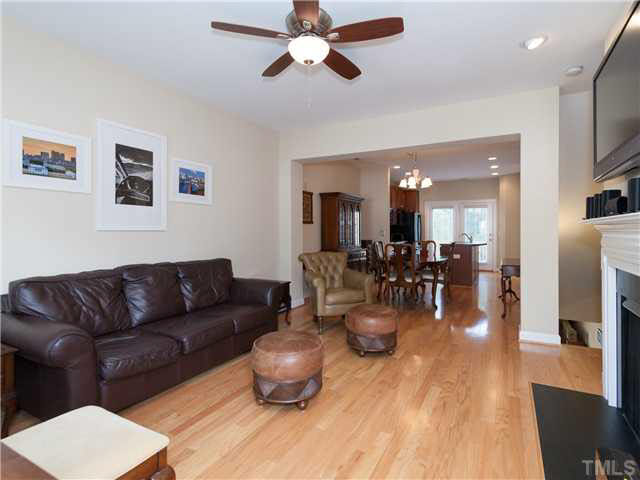 8840 Orchard Grove Way Raleigh, NC 27612 - Photo 3 of 24 Large living room with upgraded ceiling fan and hardwood floors on entire first floor!