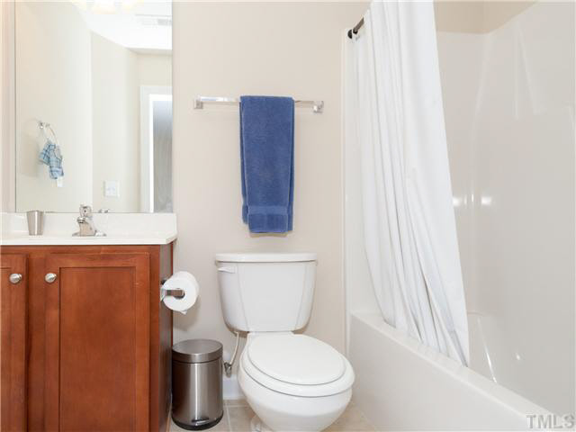 8840 Orchard Grove Way Raleigh, NC 27612 - Photo 22 of 24 This is the private bath for bedroom #2 with ceramic tile floors!