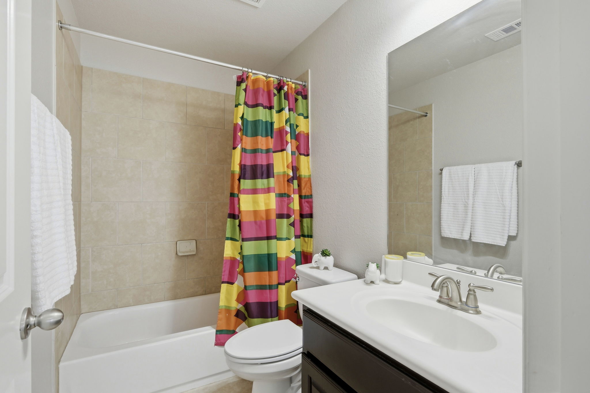 110 Dasher Drive Cedar Park, TX 78613 - Photo 26 of 39 A well-appointed bathroom features a practical vanity and a classic tub with a shower.