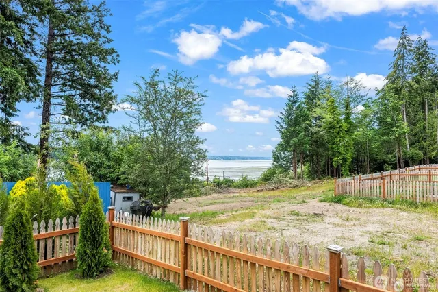 an aerial view of a house with outdoor space