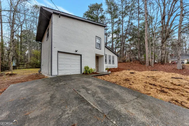 a view of garage yard and tree