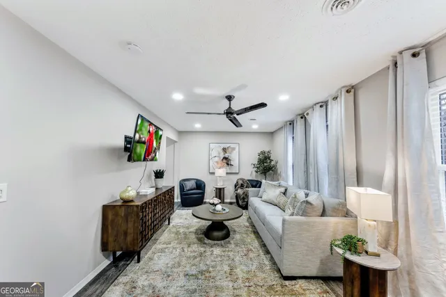 a living room with furniture and a window