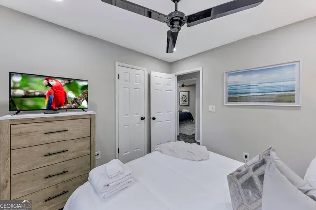 a bedroom with a bed and a dresser