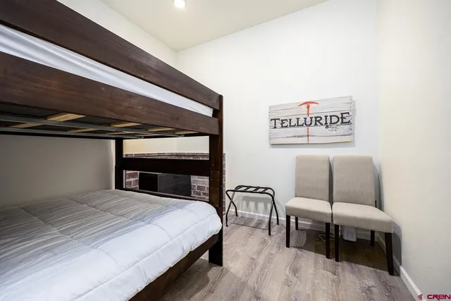 a bedroom with a bed and chair