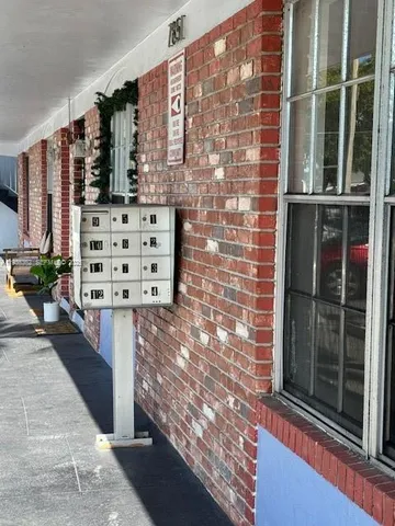 a view of balcony with a potted plants