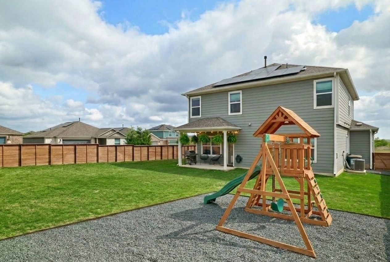 411 Jack Ryan Kyle, TX 78640 - Photo 24 of 30 a view of a house with backyard