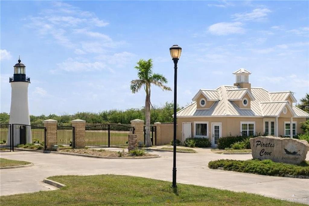 0 Captain Kidd St Port Port Isabel, TX 78578 - Photo 5 of 5 a front view of a house with a garden and mountain view