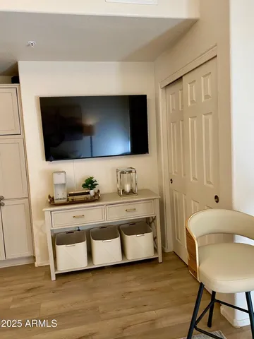 a living room with a flat screen tv and a couch