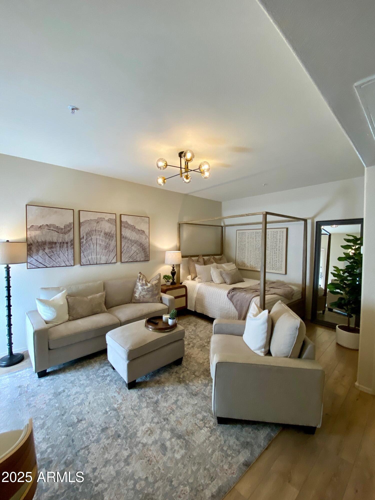 16545 East Gunsight Drive East, Unit 112 Fountain Hills, AZ 85268 - Photo 7 of 9 a living room with furniture and a chandelier