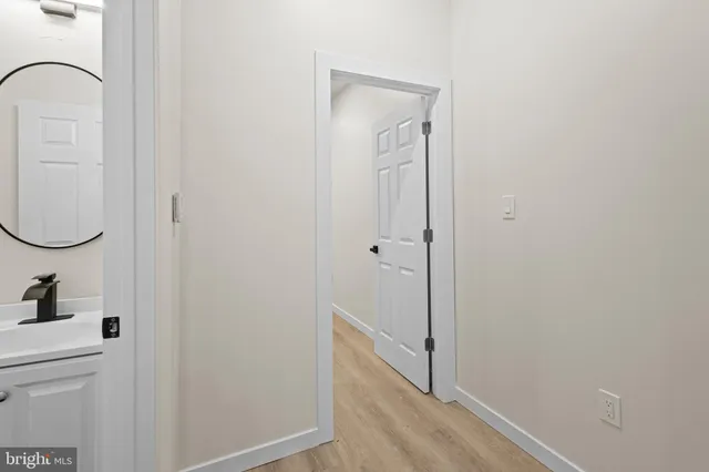 a view of a bathroom from the hallway