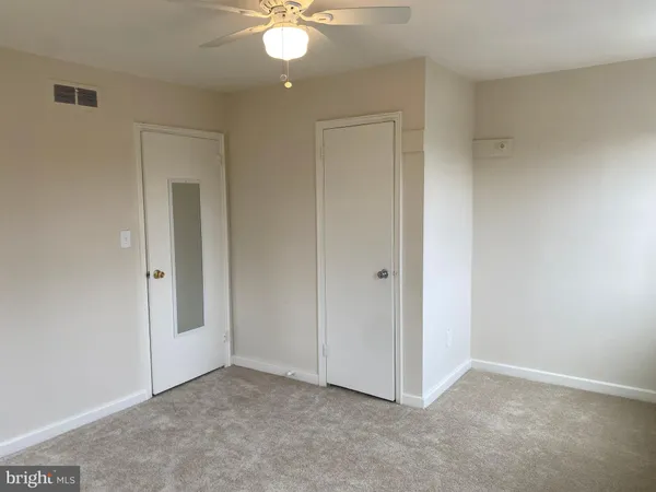an empty room with fan