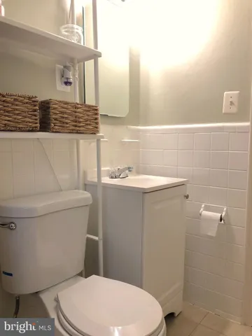 a bathroom with a toilet and a bathtub
