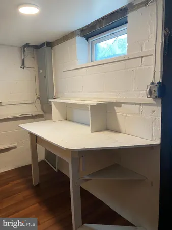 a view of storage and utility room with window