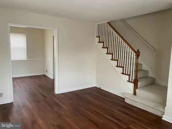a view of entryway with wooden floor