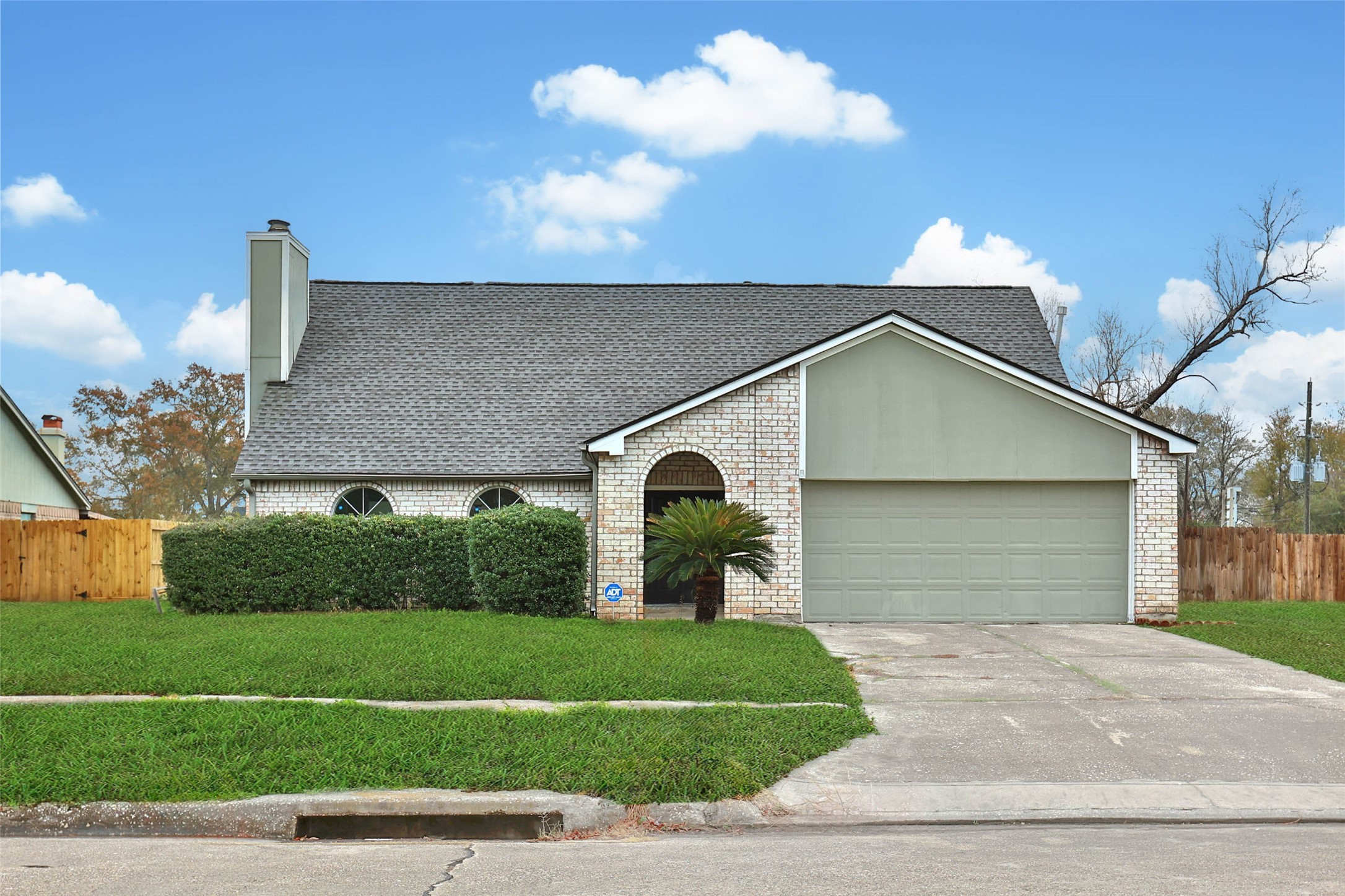 a front view of a house with garage