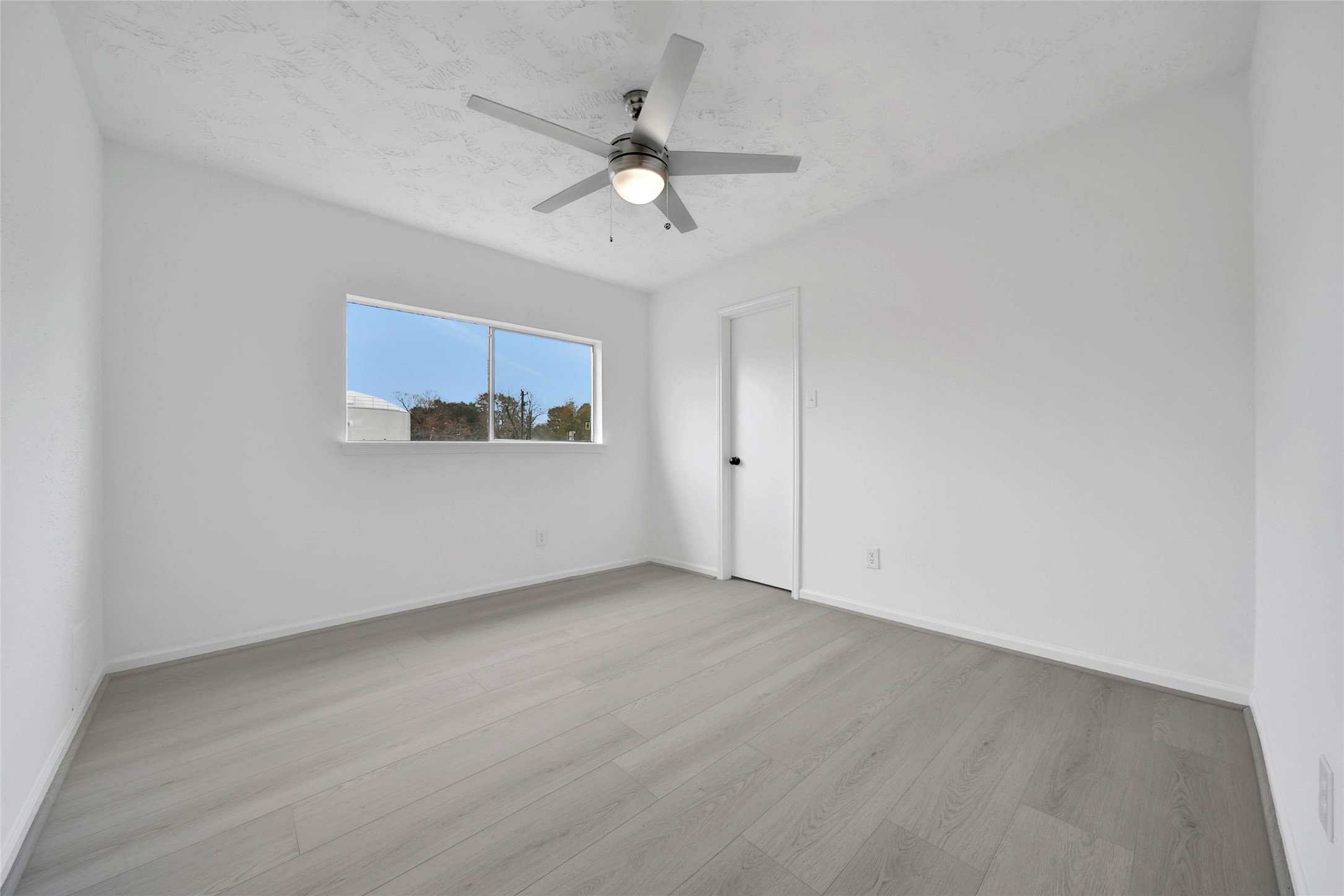 22214 Meadowhill Drive Spring, TX 77389 - Photo 11 of 13 a view of a livingroom with a ceiling fan and window