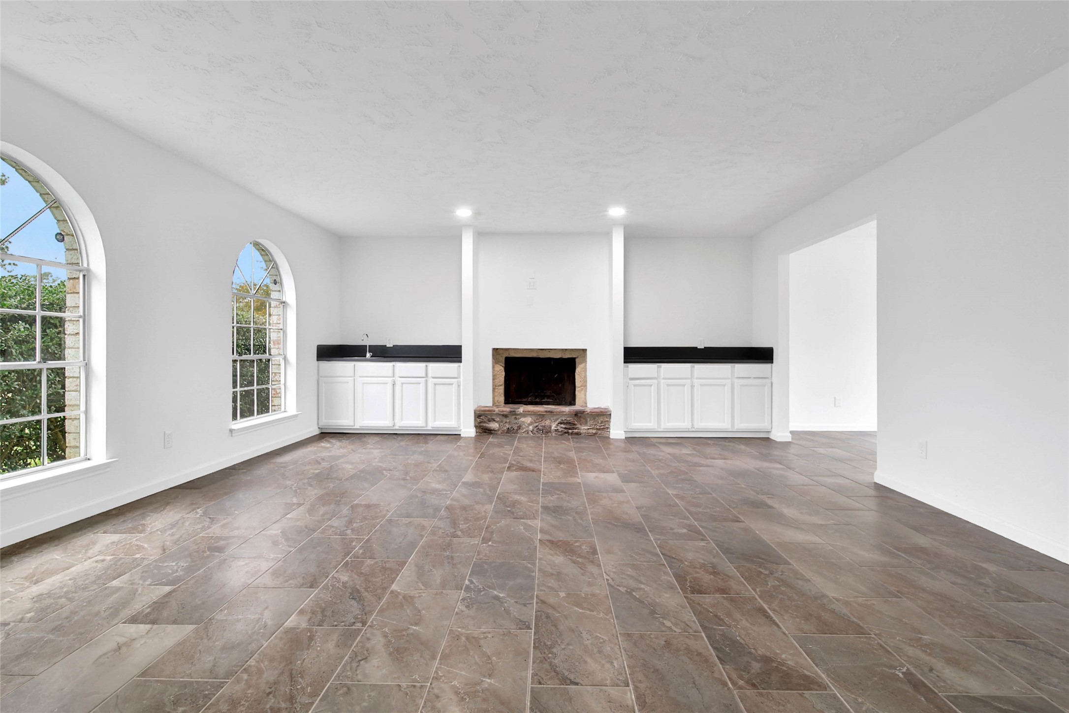 22214 Meadowhill Drive Spring, TX 77389 - Photo 4 of 13 an empty room with windows and fireplace