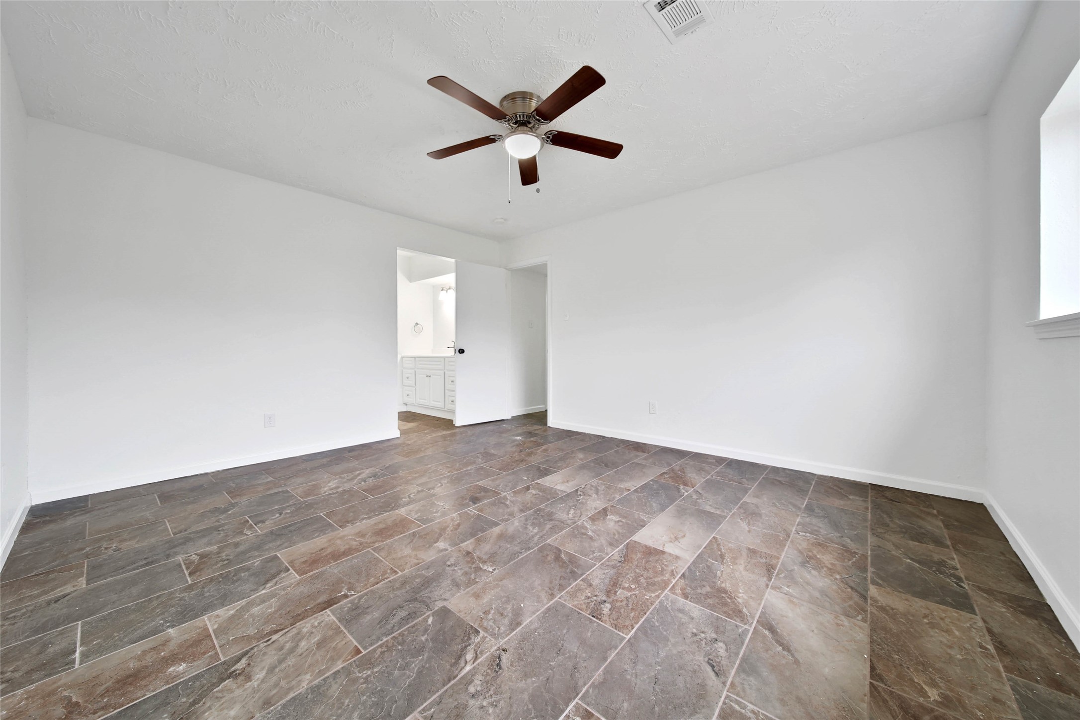 22214 Meadowhill Drive Spring, TX 77389 - Photo 7 of 13 a view of a big room with wooden floor and a ceiling fan