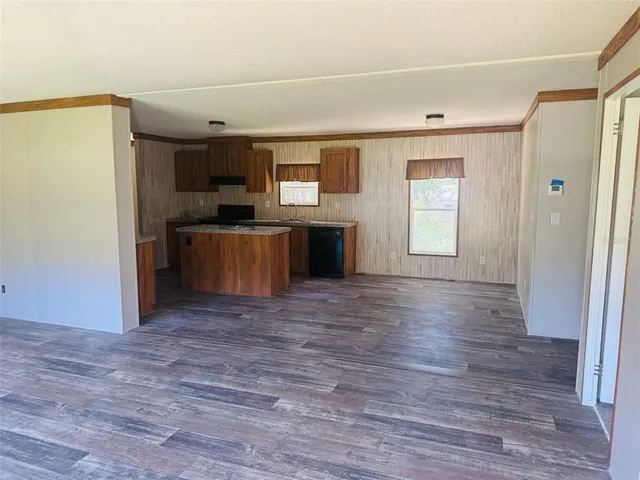 a view of a kitchen with a sink cabinet and a window