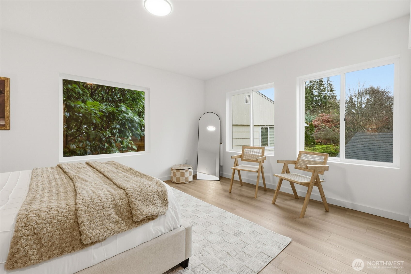 14304 1st Avenue Northwest Seattle, WA 98133 - Photo 12 of 18 a bedroom with a bed and large windows